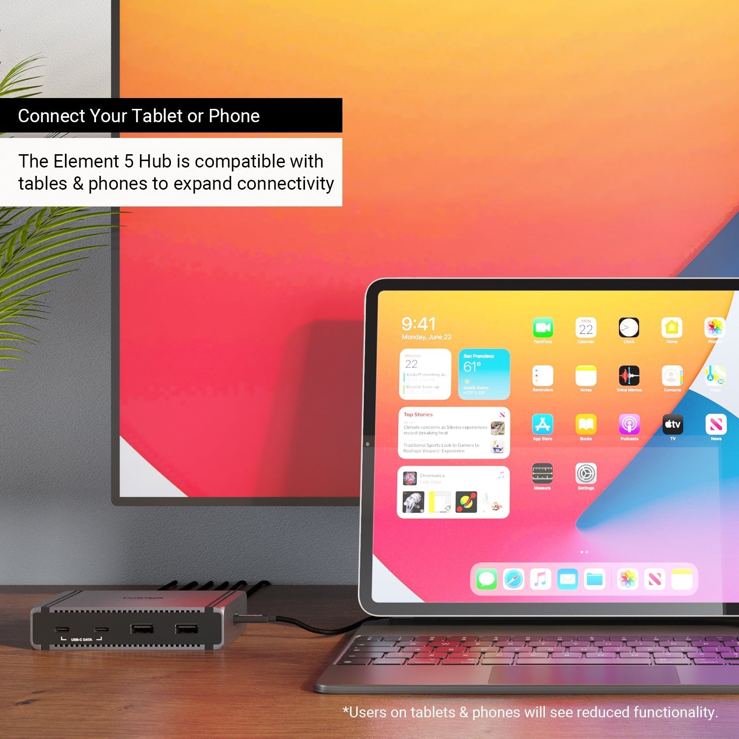An Element 5 Hub on a desk connect to an iPad and a monitor. Text on the image says "Connect your tablet or pone", and "The Element 5 Hub is compatible with tablets and phones to expand connectivity".