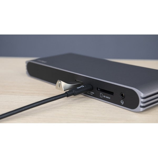 USB-C HDMI Dock on a desk with a cable connected to the USB-C port, and USB flash drive connected to a USB-A port.