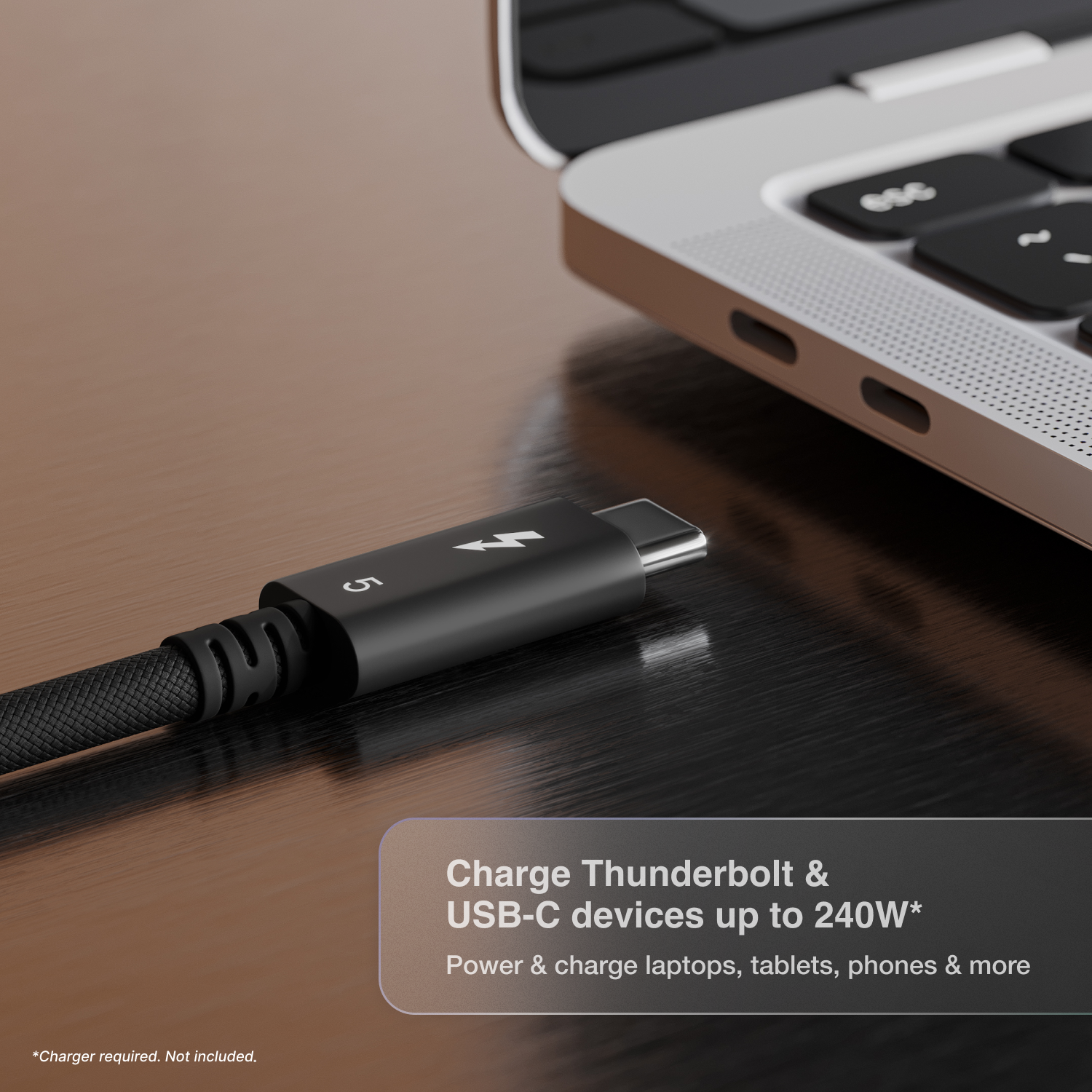 A close up image of a laptop's Thunderbolt port with a Thunderbolt 5 Pro Cable next to the port. Text on the image says "Charge Thunderbolt & USB-C devices up to 240W".