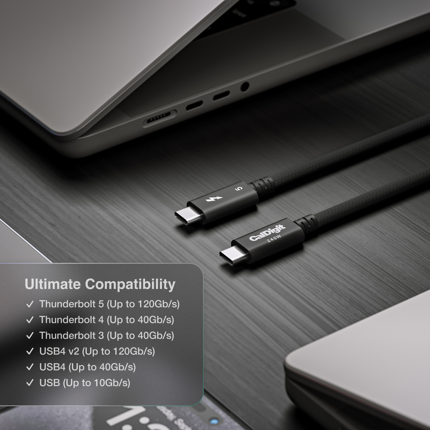 An image of a desk showing two Thunderbolt 5 Pro cables on a desk. Around the cables are various devices. Text on the image talks about the cable's compatibility.