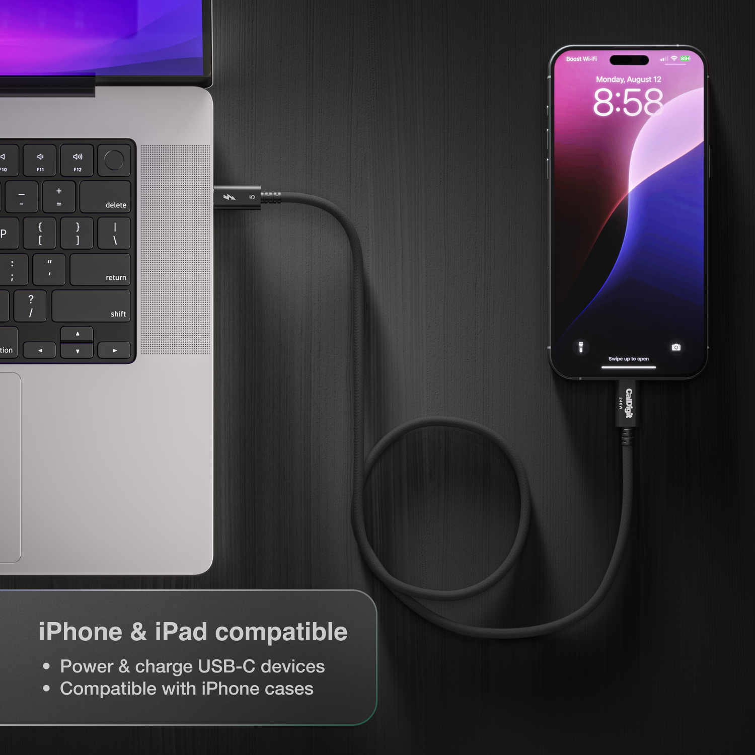 An overhead image looking down on a desk with a Thunderbolt 5 Pro Cable connected to both an iPhone and laptop. There is text on the image indicating the cable is iPhone and iPad compatible.